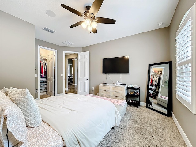 31980 Geoff Way, Sorrento, FL 32776 - bedroom featuring a walk in closet, a closet, and multiple windows