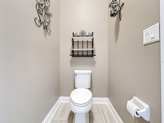 31980 Geoff Way, Sorrento, FL 32776 - bathroom with toilet and baseboards