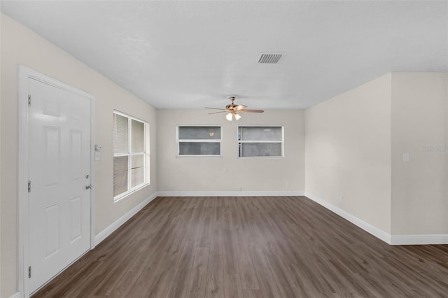 7612 Pomelo Dr, Orlando, FL 32819 - unfurnished room with ceiling fan and dark wood-type flooring