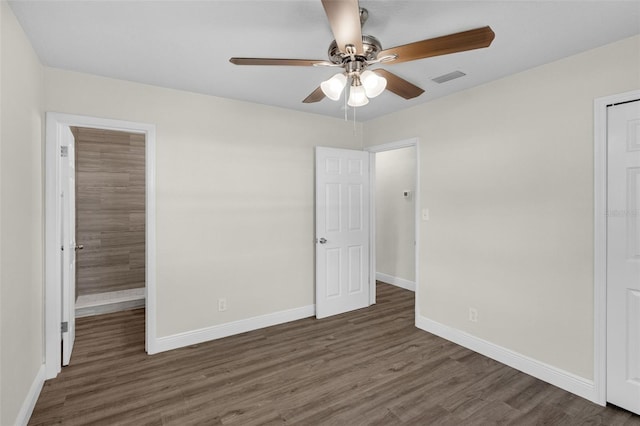 7612 Pomelo Dr, Orlando, FL 32819 - unfurnished bedroom featuring wood finished floors and a ceiling fan