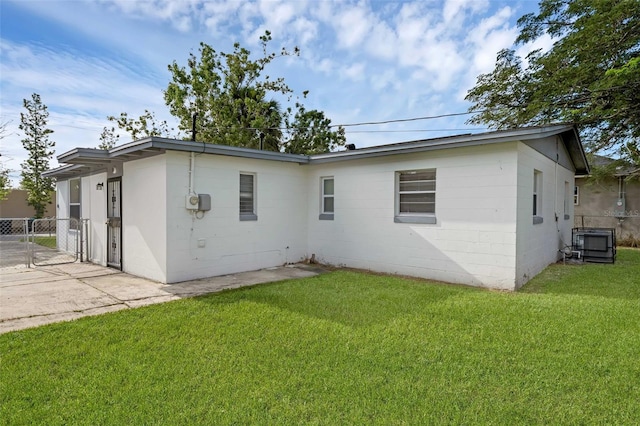 7612 Pomelo Dr, Orlando, FL 32819 - back of house featuring concrete block siding