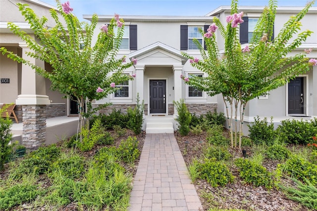 3099 Ella Way, Saint Cloud, FL 34771 - view of front of property featuring stucco siding and stone siding