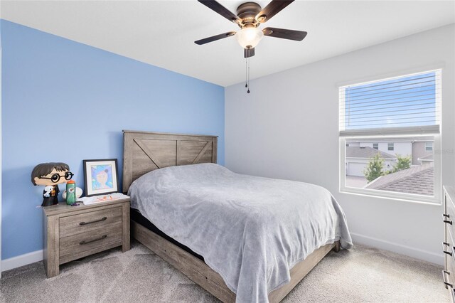3099 Ella Way, Saint Cloud, FL 34771 - carpeted bedroom with baseboards and ceiling fan