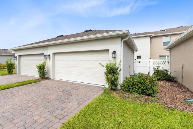 3099 Ella Way, Saint Cloud, FL 34771 - view of front of property with stucco siding and decorative driveway