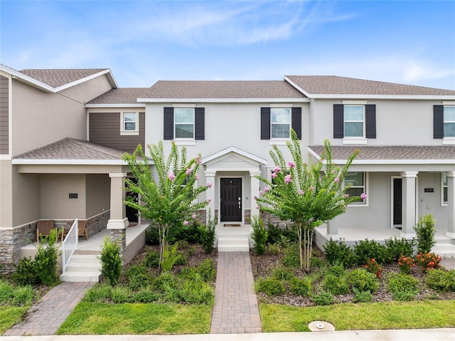3099 Ella Way, Saint Cloud, FL 34771 - multi unit property featuring a porch, roof with shingles, and stucco siding