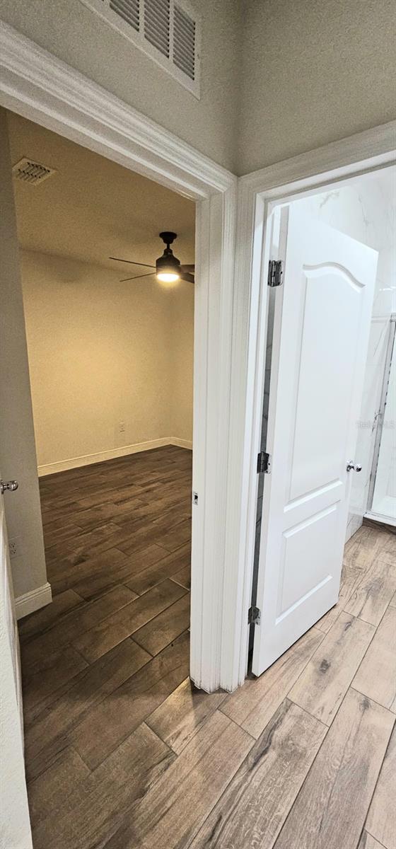 1588 Diamond Loop Dr, Kissimmee, FL 34744 - hall with wood finished floors and baseboards