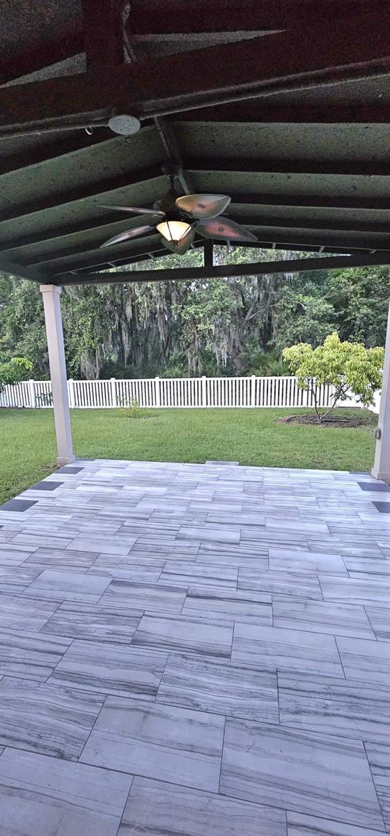 1588 Diamond Loop Dr, Kissimmee, FL 34744 - fenced backyard with a patio and ceiling fan