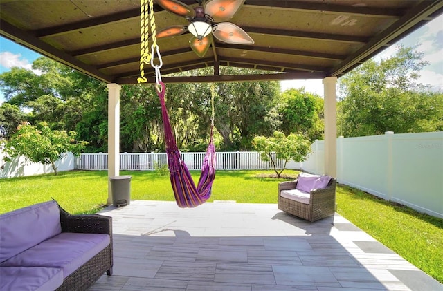 1588 Diamond Loop Dr, Kissimmee, FL 34744 - fenced backyard with a ceiling fan, a patio, an outdoor hangout area, and a gazebo
