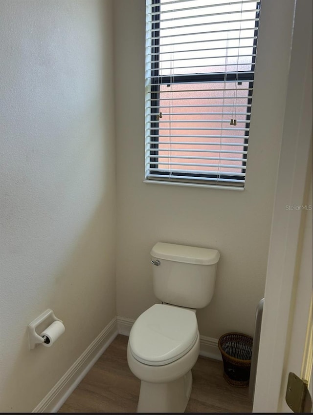 152 Glendale Ct, Kissimmee, FL 34759 - bathroom featuring wood finished floors and healthy amount of natural light