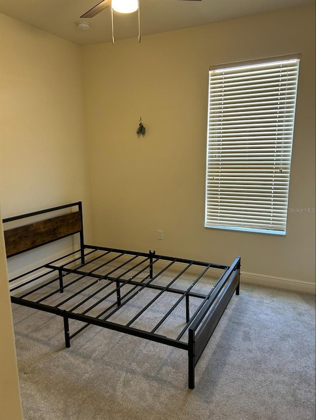 152 Glendale Ct, Kissimmee, FL 34759 - unfurnished bedroom featuring carpet and a ceiling fan
