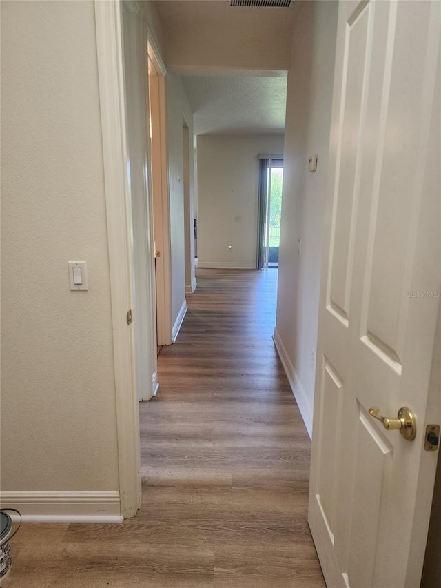 152 Glendale Ct, Kissimmee, FL 34759 - corridor with baseboards and wood finished floors