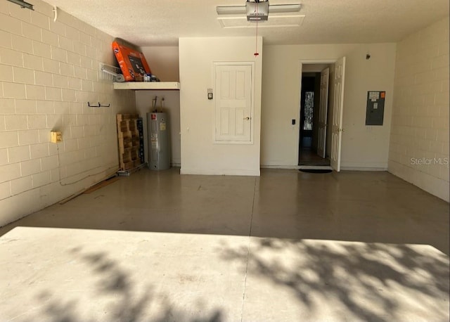 152 Glendale Ct, Kissimmee, FL 34759 - garage featuring water heater, electric panel, a garage door opener, and concrete block wall