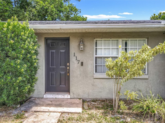 117 Burns Ave, Longwood, FL 32750 - view of exterior entry featuring stucco siding