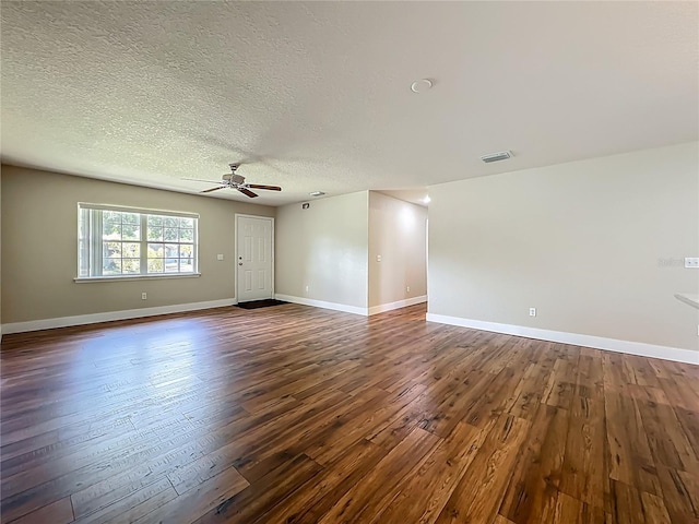 117 Burns Ave, Longwood, FL 32750 - unfurnished room featuring a ceiling fan, dark wood finished floors, and a textured ceiling