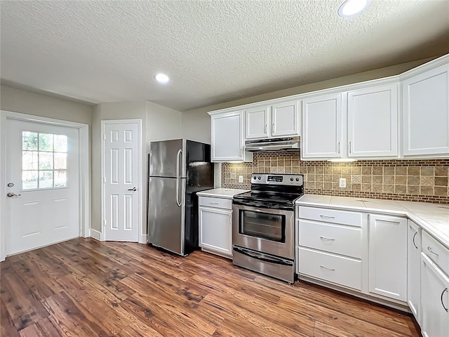 117 Burns Ave, Longwood, FL 32750 - kitchen featuring stainless steel appliances, under cabinet range hood, decorative backsplash, white cabinets, and a textured ceiling
