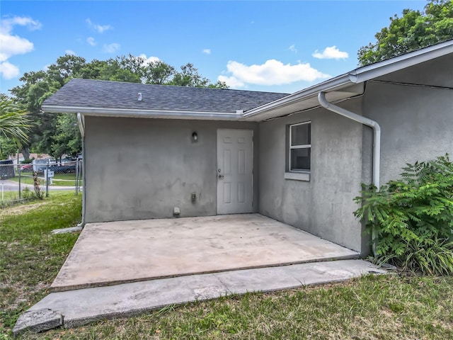 117 Burns Ave, Longwood, FL 32750 - back of property with a patio, stucco siding, and a shingled roof