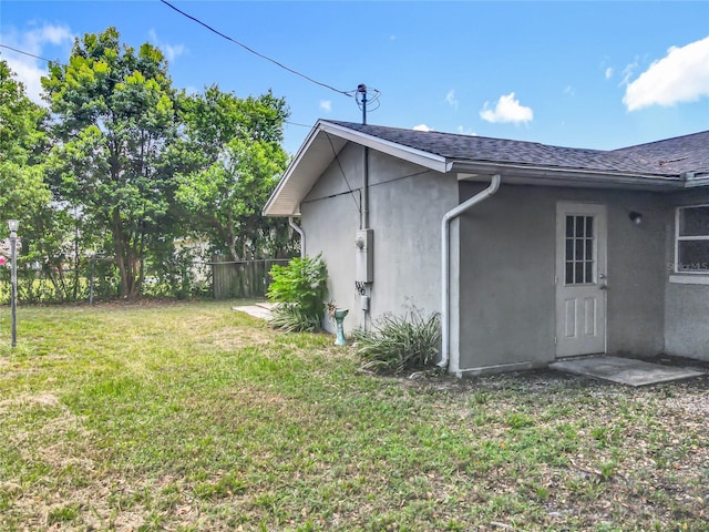 117 Burns Ave, Longwood, FL 32750 - view of side of property featuring stucco siding and a shingled roof