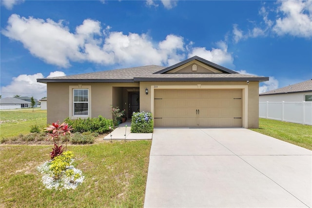 205 Cimarron Dr, Kissimmee, FL 34759 - ranch-style home with stucco siding, concrete driveway, and a garage