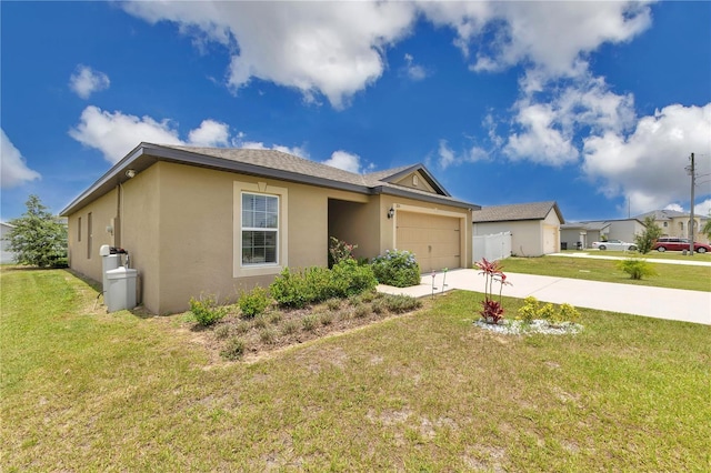 205 Cimarron Dr, Kissimmee, FL 34759 - ranch-style house featuring stucco siding, concrete driveway, a garage, and a front lawn
