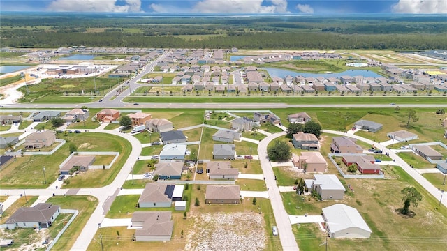 205 Cimarron Dr, Kissimmee, FL 34759 - aerial view of property's location featuring a large body of water and nearby suburban area