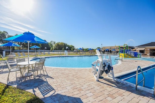 205 Cimarron Dr, Kissimmee, FL 34759 - community pool featuring a patio area