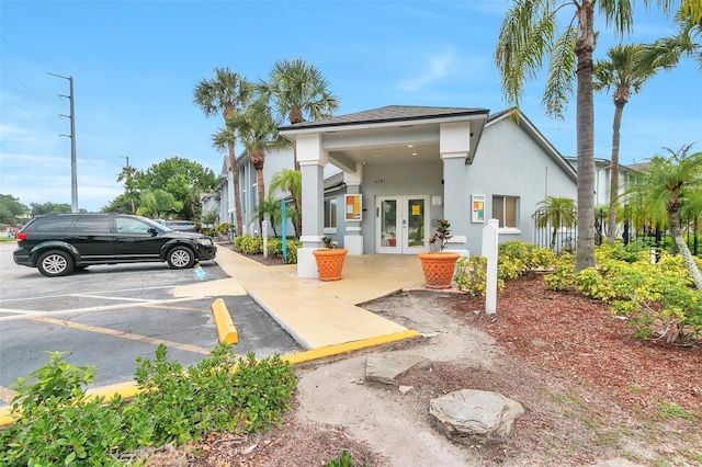 4701 S Texas Ave Unit 4701A, Orlando, FL 32839 - back of house featuring french doors, uncovered parking, and stucco siding