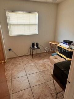 bedroom featuring tile patterned flooring