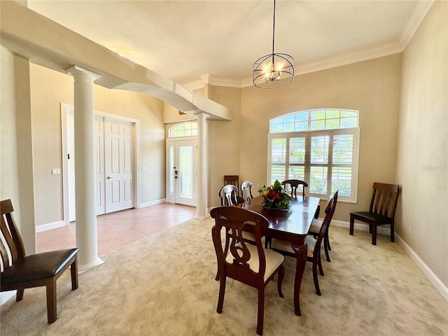 800 Sterling Chase Dr, Port Orange, FL 32128 - dining space featuring light carpet, decorative columns, crown molding, a chandelier, and light tile patterned floors