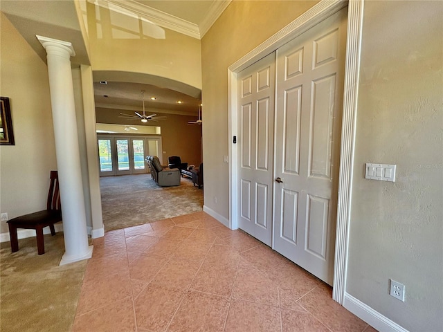 800 Sterling Chase Dr, Port Orange, FL 32128 - corridor with arched walkways, ornamental molding, decorative columns, light colored carpet, and light tile patterned floors