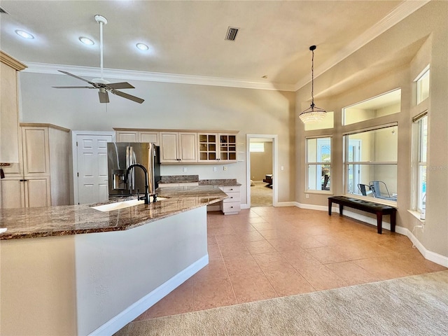 800 Sterling Chase Dr, Port Orange, FL 32128 - kitchen with stainless steel fridge with ice dispenser, crown molding, light tile patterned floors, plenty of natural light, and a ceiling fan