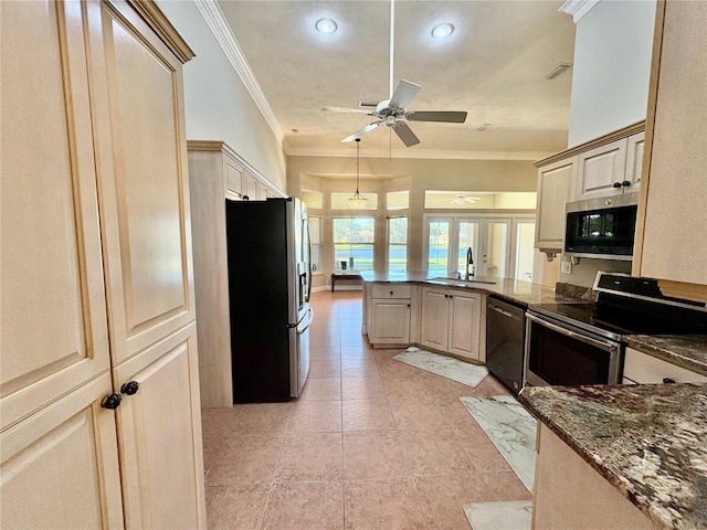 800 Sterling Chase Dr, Port Orange, FL 32128 - kitchen with appliances with stainless steel finishes, crown molding, a peninsula, a ceiling fan, and light tile patterned floors