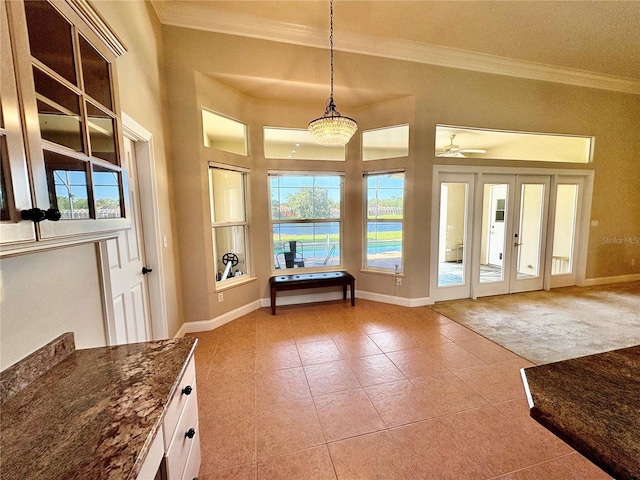 800 Sterling Chase Dr, Port Orange, FL 32128 - entryway featuring crown molding, light tile patterned floors, and light colored carpet