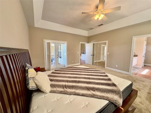 800 Sterling Chase Dr, Port Orange, FL 32128 - bedroom featuring french doors, light colored carpet, access to outside, ceiling fan, and ensuite bath