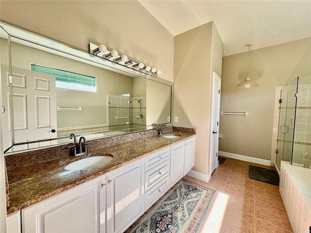 800 Sterling Chase Dr, Port Orange, FL 32128 - bathroom featuring a stall shower, double vanity, and tile patterned flooring