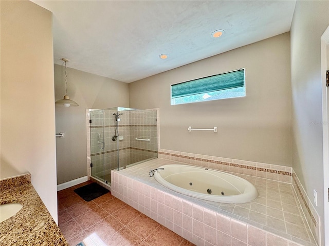 800 Sterling Chase Dr, Port Orange, FL 32128 - bathroom featuring a stall shower, a jetted tub, vanity, tile patterned floors, and recessed lighting