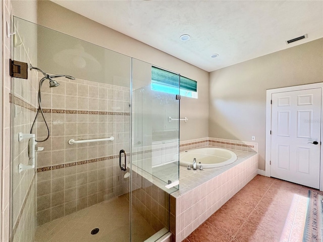 800 Sterling Chase Dr, Port Orange, FL 32128 - bathroom featuring a stall shower, a garden tub, and tile patterned floors