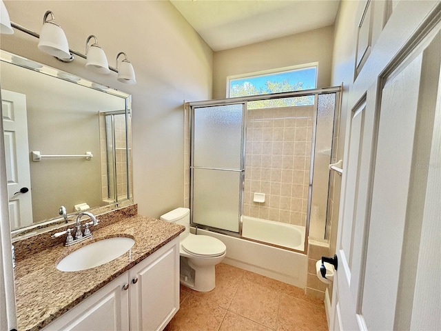 800 Sterling Chase Dr, Port Orange, FL 32128 - full bath with vanity, bath / shower combo with glass door, and tile patterned flooring