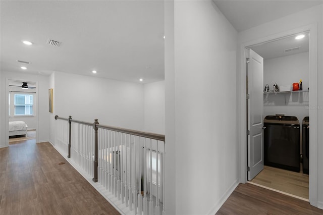 15133 Summer Harvest St, Winter Garden, FL 34787 - hall with washing machine and dryer, wood finished floors, and recessed lighting