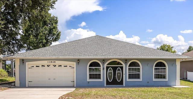 13848 Vista Del Lago Blvd, Clermont, FL 34711 - ranch-style home with concrete driveway, stucco siding, an attached garage, a front yard, and a shingled roof