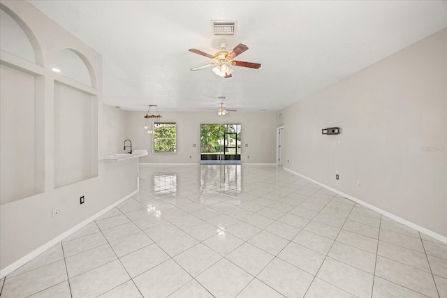 13848 Vista Del Lago Blvd, Clermont, FL 34711 - empty room with light tile patterned flooring and ceiling fan