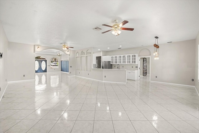 13848 Vista Del Lago Blvd, Clermont, FL 34711 - unfurnished living room featuring ceiling fan and light tile patterned flooring