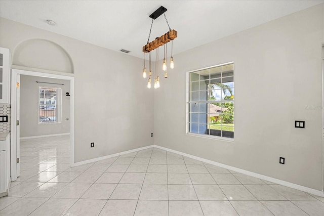 13848 Vista Del Lago Blvd, Clermont, FL 34711 - spare room with light tile patterned floors and healthy amount of natural light