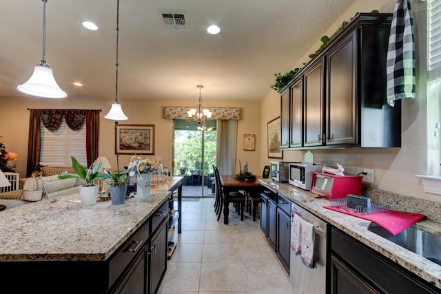 30210 Donnington Loop, Mount Dora, FL 32757 - kitchen featuring white microwave, dishwasher, a chandelier, hanging light fixtures, and light stone counters