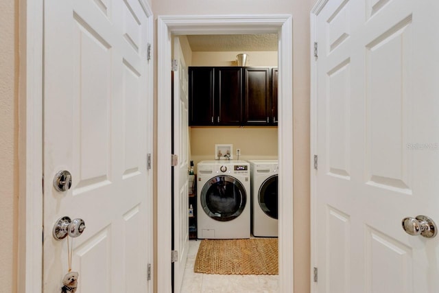 30210 Donnington Loop, Mount Dora, FL 32757 - washroom with separate washer and dryer, light tile patterned floors, and cabinet space