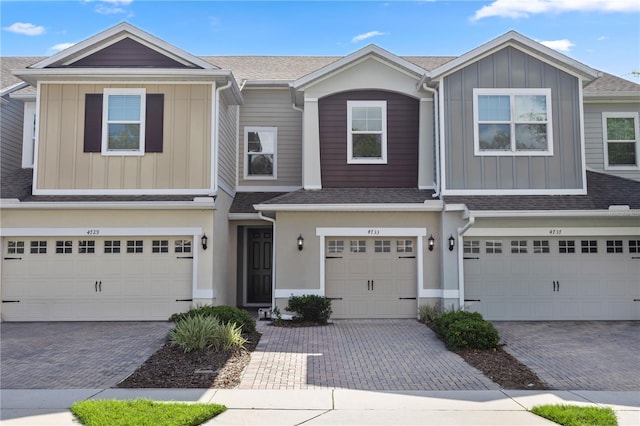 4733 Cliveden Loop, Sanford, FL 32773 - multi unit property with an attached garage, decorative driveway, board and batten siding, and a shingled roof