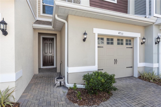 4733 Cliveden Loop, Sanford, FL 32773 - view of exterior entry with stucco siding and a garage