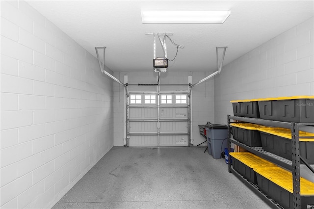 4733 Cliveden Loop, Sanford, FL 32773 - garage featuring a garage door opener and concrete block wall