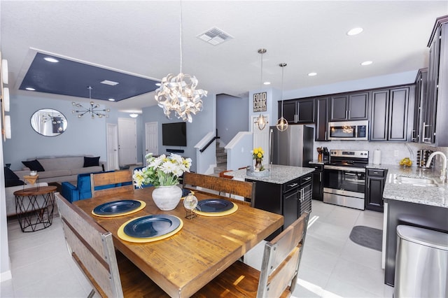 4733 Cliveden Loop, Sanford, FL 32773 - dining space with a chandelier, light tile patterned floors, recessed lighting, and stairway
