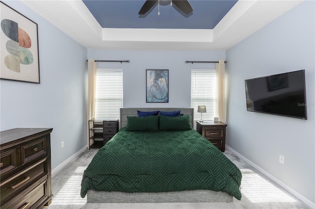 4733 Cliveden Loop, Sanford, FL 32773 - bedroom featuring a raised ceiling, light carpet, and ceiling fan