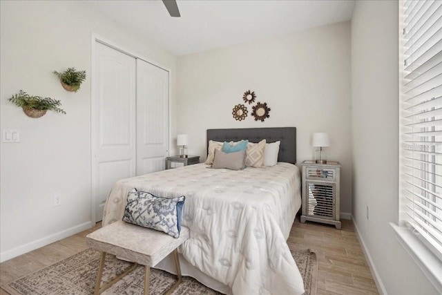 55 Sea Breeze Trl, Palm Coast, FL 32164 - bedroom with light wood-type flooring, a closet, and ceiling fan